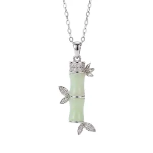 Dainty silver-colored bamboo joint necklace with green faux jade and crystal accents