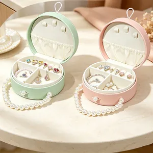 Portagioie rotondi portatili rosa e verdi con eleganti manici di perle