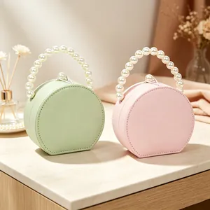 Portagioie tondo portatile con elegante manico in perle per viaggio e casa