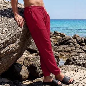 Stylish men's casual drawstring beach pants in deep red with textured patchwork design