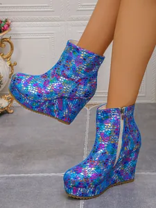 Detailed view of colorful holographic pattern on wedge platform boots with side zipper