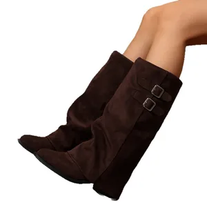 Elegant brown suede slouch boots featuring pointed toes and chunky mid heels with buckles.
