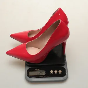 Detail view of lightweight red patent leather pointed-toe stiletto heel weighing 125g
