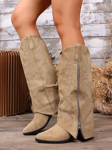 Detailed view of khaki slouchy knee-high boots with embroidery and pointed toe design