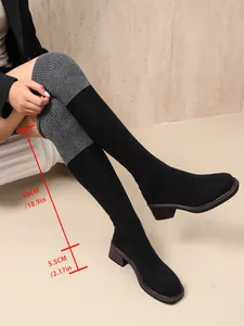 Detailed view of black stretch over-the-knee sock boots with a 5.5cm chunky mid heel