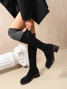 High-stretch over-the-knee sock boots with a steady block heel and slim fit design