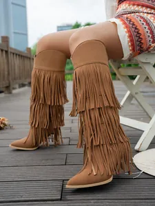 Stylish brown suede fringe knee-high boots featuring pointed toe and stiletto heels.