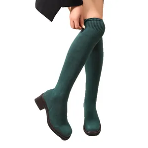 Dark green over-the-knee sock boots with chunky mid-heel and stretch knit fabric.