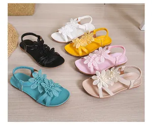 Bohemian flat sandals for women featuring floral fabric details and elastic straps
