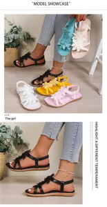 Bohemian style flat sandals featuring 3D fabric flower details and elastic back straps.