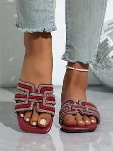 Elegant red flat slides for women with dazzling rhinestone embellishments and square toe.