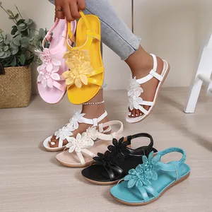 Bohemian flat sandals with decorative flowers and elastic back strap in multiple colors