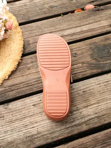 Detail view of the slip-resistant sole of women's wedge sandals with size 36 mark