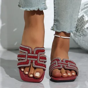 Fashionable red flat sandals with sparkling rhinestone patterns for summer casual wear