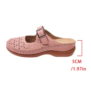 Close-up detail of women's pink hollowed wedge mule showing the 5cm heel height