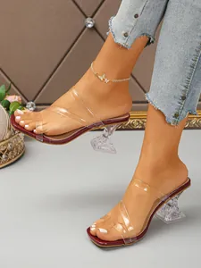 Close-up of stylish square toe sandals with transparent straps and clear goblet heels