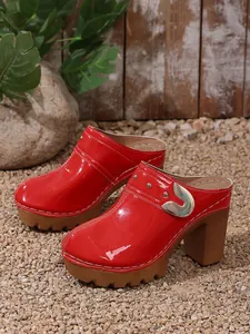 Elegant red patent leather platform high heel clogs with silver rivet details and chunky sole.