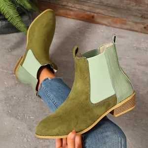 Retro green suede Chelsea boots with croc-pattern heel and wood-grain square heel.