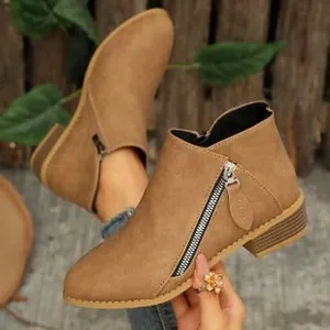 Stylish brown faux leather ankle boots featuring side zipper detail and round toe design