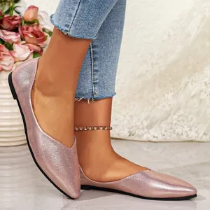Elegant rose gold pointed-toe flat shoes with shimmery finish for sophisticated women