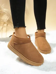 Detail view of chestnut classic snow boots with soft plush lining and durable sole