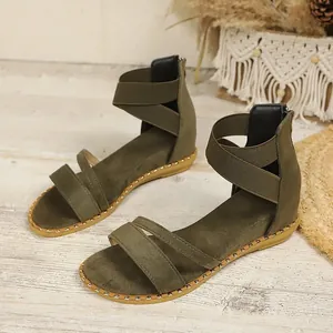 Bohemian army green flat sandals with elastic ankle straps and gold-tone stud details