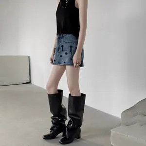 Stylish blue denim mini skirt with black floral details for trendy women's fashion