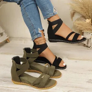 Women's Roman style sandals with elastic straps and back zipper in black and green.