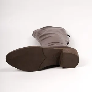 Detailed view of the anti-slip brown sole and sturdy heel of a comfortable boot