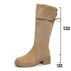Detailed view of beige suede knee-high boots showing heel and shaft measurements