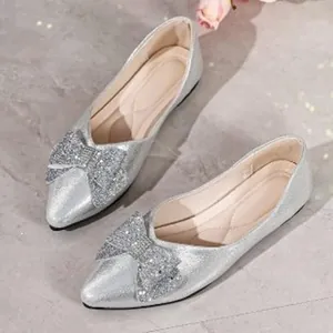 Elegant silver glitter pointed-toe ballet flats with sparkling rhinestone bow decoration