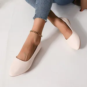 Elegant cream pointed-toe ballet flats for women with minimalist leather design.