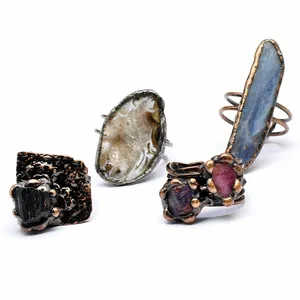 Collection of vintage-style rings featuring natural agate geodes and raw crystal clusters