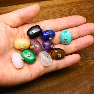 Detailed view of colorful natural stone barrel beads with inlaid zircon for DIY jewelry