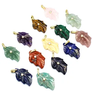 Assorted natural stone leaf pendants with zircon-encrusted gold bails detail view