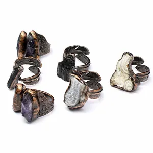 Various vintage open rings featuring raw crystals, black tourmaline, and agate druzy