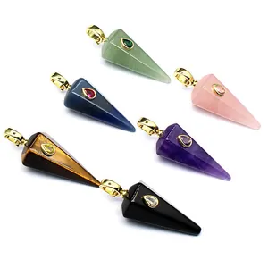 Macro view of various multi-color hexagonal conical crystal pendants with gold bails