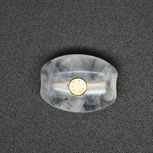 Macro view of natural strawberry quartz bead with gold zircon inlay and large hole.