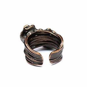 Detailed view of an adjustable vintage copper ring featuring raw agate geode texture
