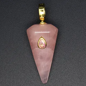Close-up detail of a hexagonal rose quartz cone pendant with a teardrop pink stone inlay