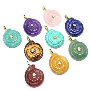Collection of ocean-inspired spiral seashell pendants carved from various natural gemstones