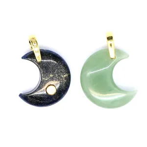 Close-up of natural stone crescent moon pendants with gold-plated zircon inlaid bails
