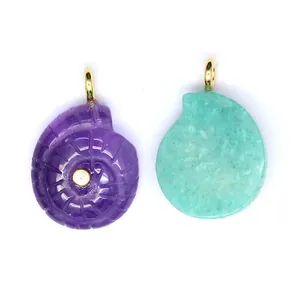 Detailed view showing purple and turquoise carved natural stone ammonite shell pendants.