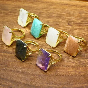 Collection of gold adjustable rings with rectangular faceted natural gemstones