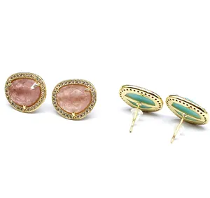 Detailed macro view of 24K gold plated sunstone stud earrings with crystal halo.