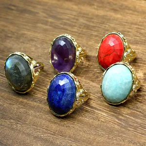 Detailed view of vintage oval faceted natural stone rings with gold-plated adjustable bands