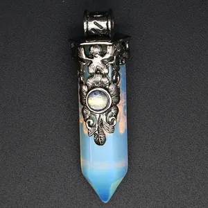 Macro view of vintage carved silver cap on opalite hexagonal point pendant