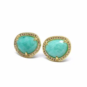 Detail shot of faceted natural stone stud earrings with 24K gold plated micro-inset crystal halo