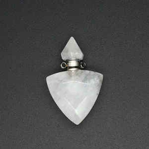 Macro detail of white triangular faceted natural stone essential oil bottle pendant