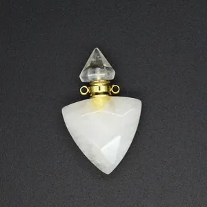 Detailed macro shot of a faceted white quartz triangle aromatherapy bottle pendant